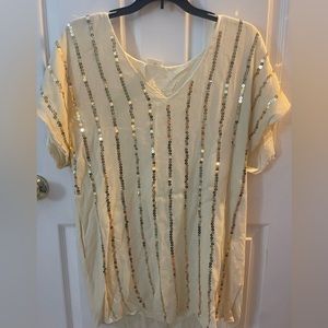 Cream dress with gold sequence, size medium, by together, has pockets.